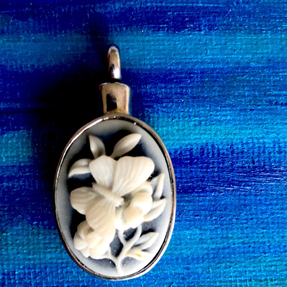 Vintage butterfly flower cameo style. George forever with me on backside.